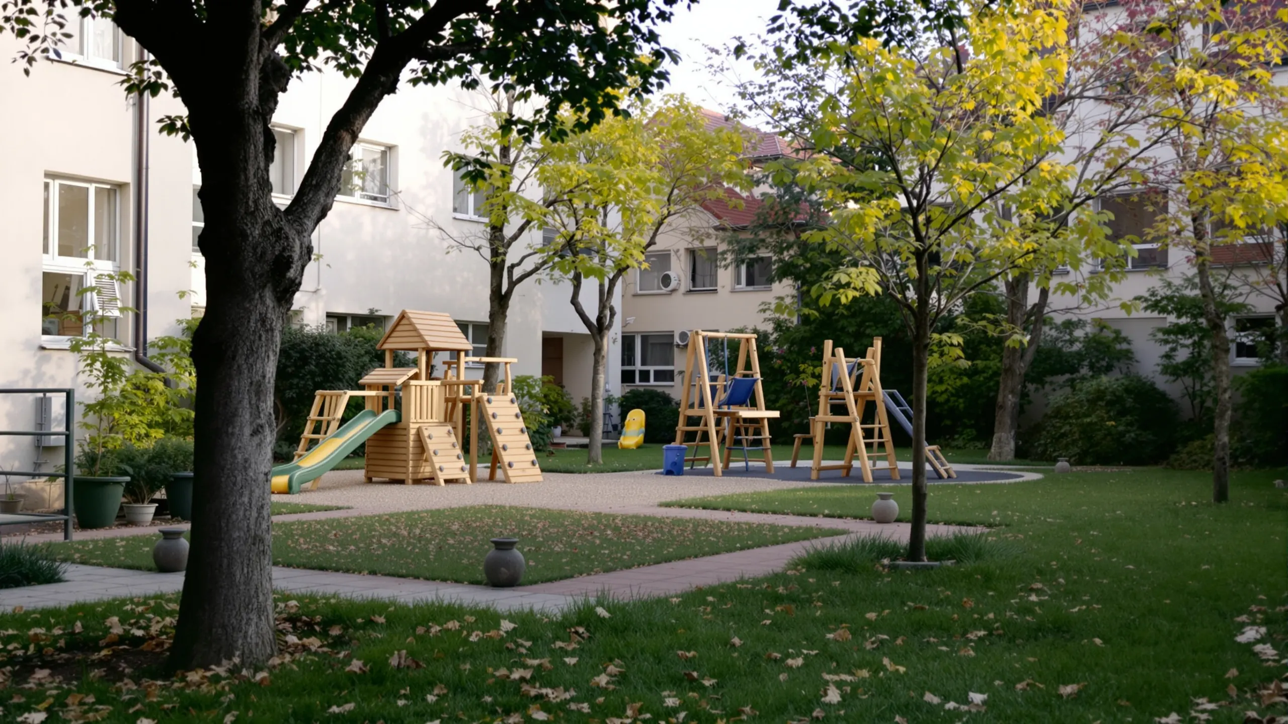 A small playground with wooden equipment in a residential courtyard